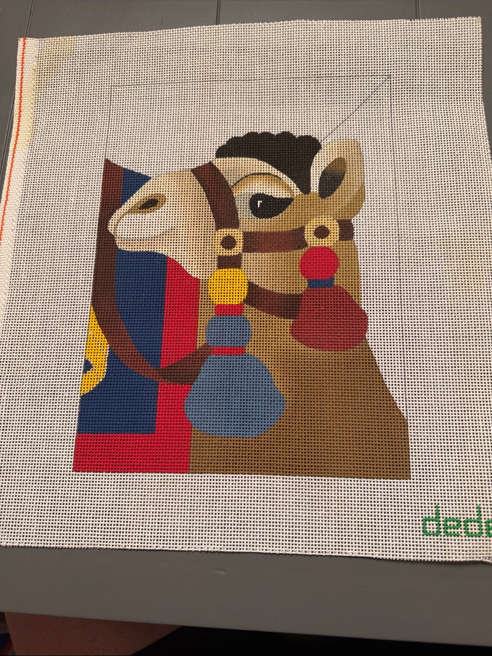 Dede Hand Painted Needlepoint Canvas features a colorful, camel design. 🐈‍⬛